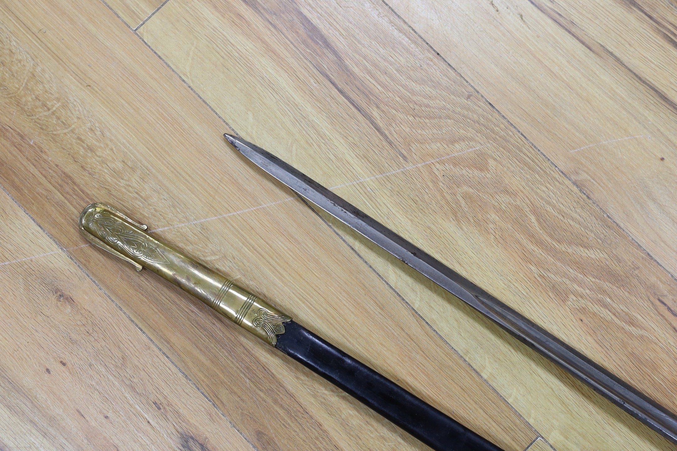 A George V naval officers sword, made by Friedeberg Portsea, serial number 4351 stamped to spine